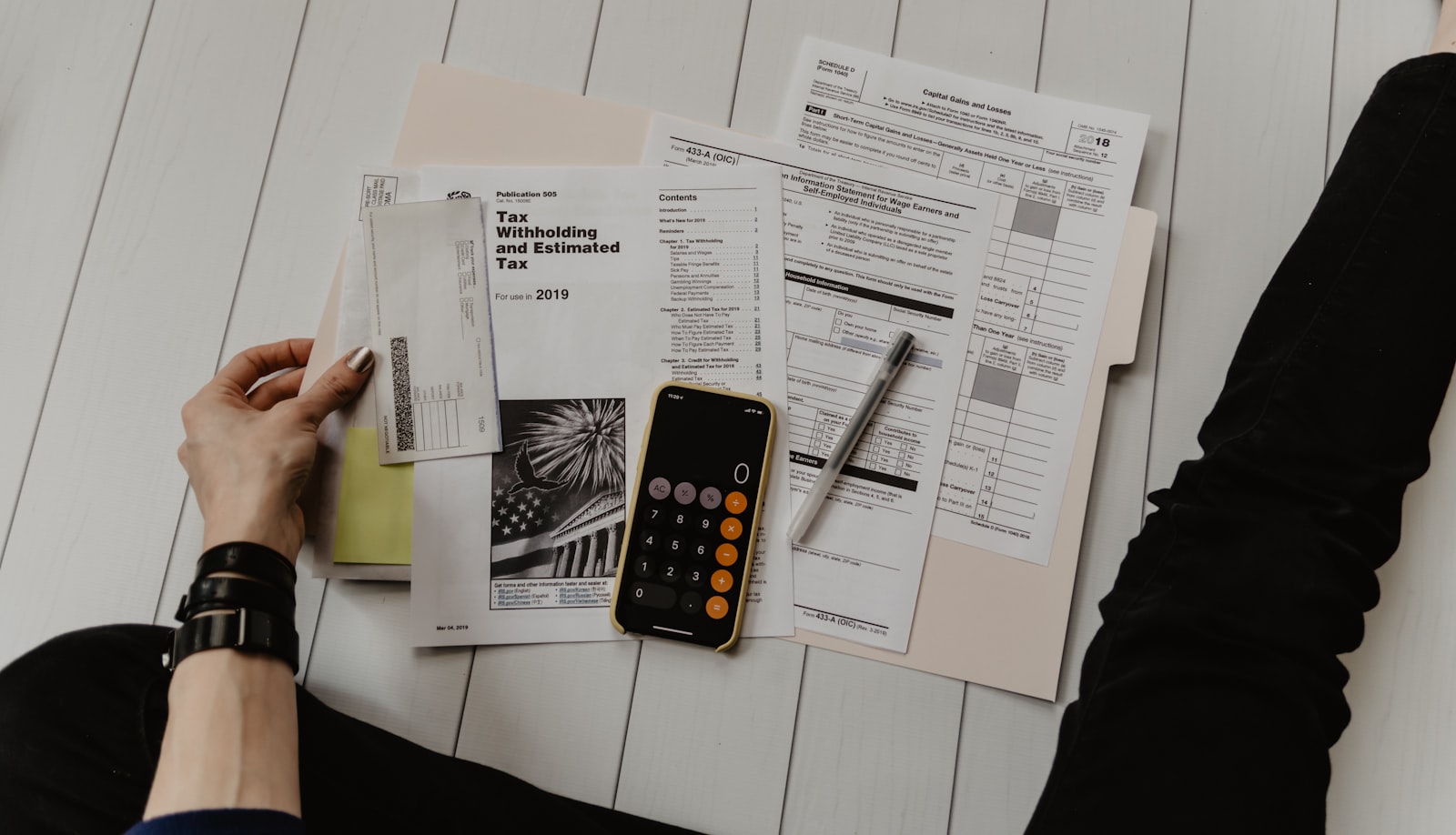Loan paperwork and a fountain pen on a desk.